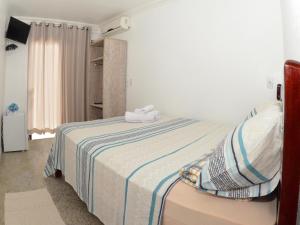 Ένα ή περισσότερα κρεβάτια σε δωμάτιο στο Hotel Engenho