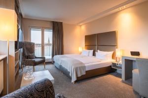 Postel nebo postele na pokoji v ubytování Thomas Hotel Spa & Lifestyle + 37 fotografií