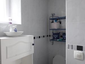 a white bathroom with a sink and a toilet at Chambres d'Hotes Elvire et Laurent Barbey in Sainte-Marie-du-Mont +37 photos
