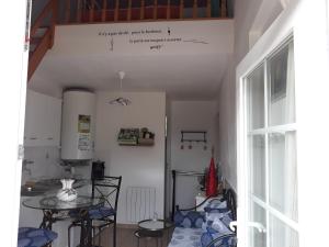 a dining room with a table and a window at Chambres d'Hotes Elvire et Laurent Barbey in Sainte-Marie-du-Mont