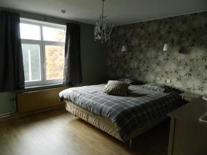 Postel nebo postele na pokoji v ubytování B&B Les Tchéous