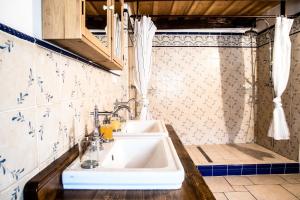 a bathroom with a sink and a shower at Chalupa u Studánky in Spálené +41 photos