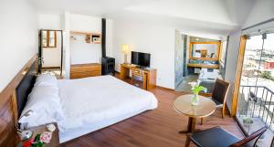 Postel nebo postele na pokoji v ubytování La Hostería Boutique Hotel