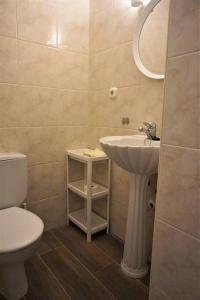 a bathroom with a sink and a toilet at CASA LUCA in Estepona +23 photos