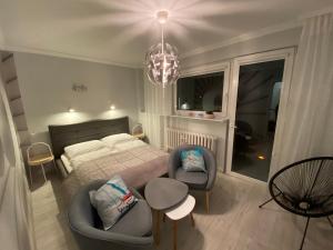 Posteľ alebo postele v izbe v ubytovaní Blue Sky Apartament
