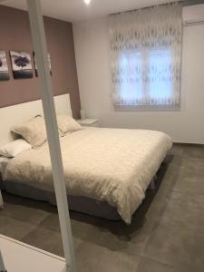 Postel nebo postele na pokoji v ubytování LA OLMA apartamentos