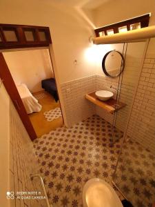 Ett badrum på Maloca Hospedagem