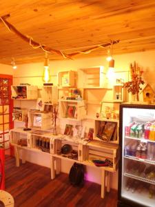 a room with a refrigerator filled with lots of food at Maloca Hospedagem in Sao Jorge