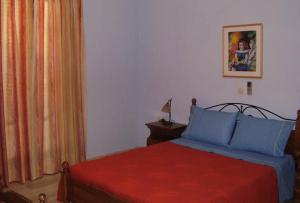 Säng eller sängar i ett rum på Villa Bonatsa Andros Home