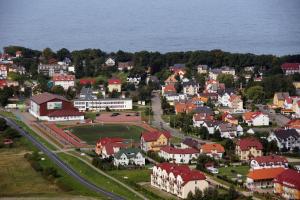 an aerial view of a small town next to the water at Akwen in Rewal