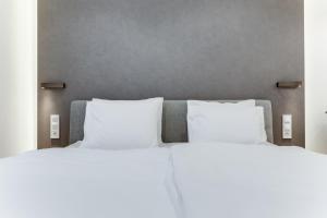 Posteľ alebo postele v izbe v ubytovaní Lampi Aparthotel Prague