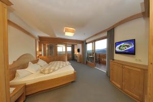 Łóżko lub łóżka w pokoju w obiekcie Hotel Rosslaufhof