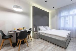 Posteľ alebo postele v izbe v ubytovaní Lampi Aparthotel Prague