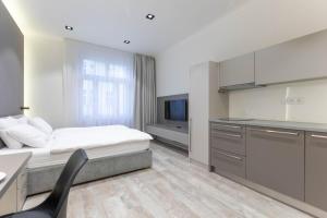 Posteľ alebo postele v izbe v ubytovaní Lampi Aparthotel Prague