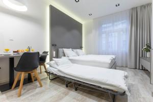 Posteľ alebo postele v izbe v ubytovaní Lampi Aparthotel Prague