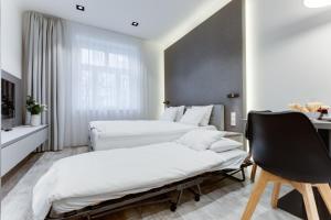 Posteľ alebo postele v izbe v ubytovaní Lampi Aparthotel Prague
