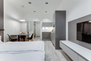 Ένα ή περισσότερα κρεβάτια σε δωμάτιο στο Lampi Aparthotel Prague