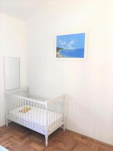 Postel nebo postele na pokoji v ubytování Apartment Marijana Baška