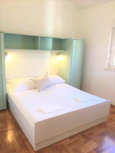 Postel nebo postele na pokoji v ubytování Apartment Marijana Baška
