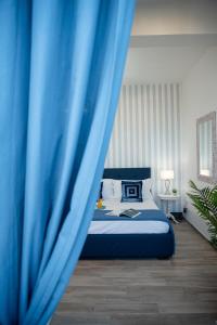 Postel nebo postele na pokoji v ubytování Porta Aragonese Luxury Rooms