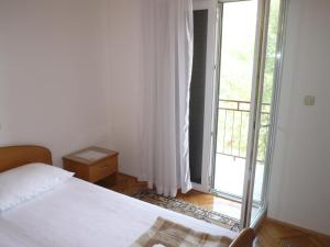 Postel nebo postele na pokoji v ubytování Apartments Šarić