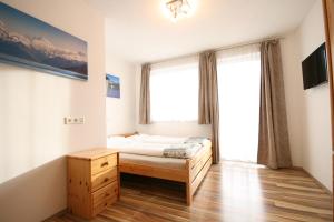 A bed or beds in a room at Haus Magdalena