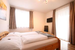 A bed or beds in a room at Haus Magdalena