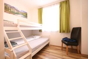 A bed or beds in a room at Haus Magdalena