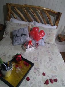 Cama ou camas em um quarto em Pousada Recanto do Lago