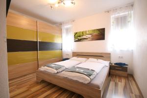 A bed or beds in a room at Haus Magdalena