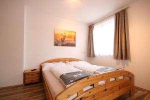 A bed or beds in a room at Haus Magdalena