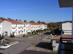 an aerial view of a street with buildings and a white truck at Casa Vacanze Isabella in Aliano