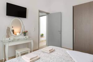 A bed or beds in a room at Aramis Boutique House