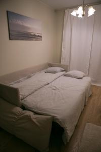 Vuode tai vuoteita majoituspaikassa Local Nordic Apartments - Snow Weasel