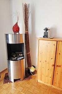 a fire place in a living room next to a wooden cabinet at Perle de Leysin in Leysin