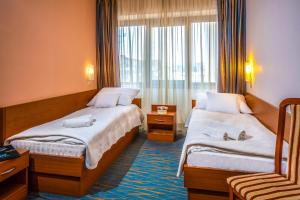 Posteľ alebo postele v izbe v ubytovaní Duna Hotel