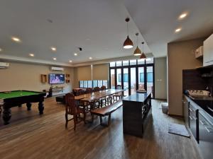 a living room with a pool table and ping pong ball at Thepprasit Cosy in Jomtien Beach