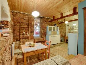 a kitchen and dining room with a table and a refrigerator at Koko Ryku in Nowa Ruda +41 photos