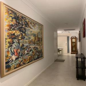 a large painting on a wall in a hallway at Ascot Comfort in Perth