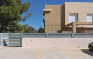 a fence in front of a house at 2 Bedroom Gorgeous Home In Miami Platja in Les Planes del Rei