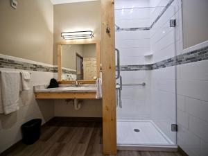 a bathroom with a sink and a bathtub at Caberfae Peaks Ski & Golf Resort in Harrietta