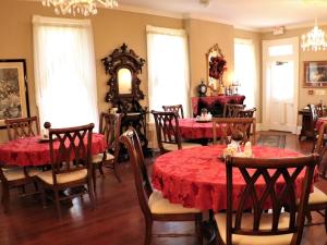 a dining room filled with tables and chairs at 50 Lincoln Short North Bed & Breakfast in Columbus