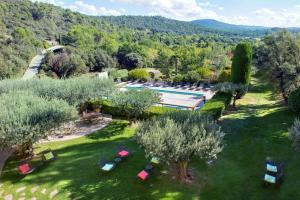 an aerial view of a garden with a pool and trees at La Bastide du Calalou; BW Signature Collection in Moissac-Bellevue