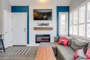a living room with a couch and a fireplace at Blue Mountain Studio Loft at North Creek Resort in Blue Mountains +26 photos