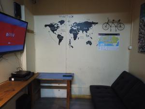a room with a world map on the wall at Patagonia House in Punta Arenas