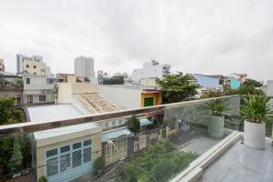 an apartment balcony with a view of a city at Siro House Da Nang Homestay in Da Nang