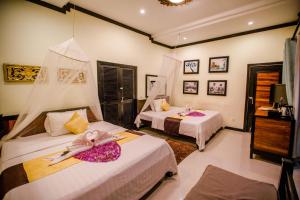 Säng eller sängar i ett rum på The Sanctuary Villa Battambang