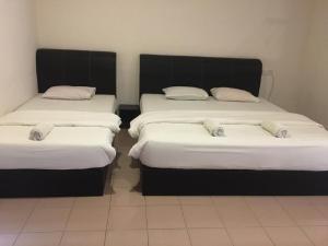 Postel nebo postele na pokoji v ubytování Anderson Hotel