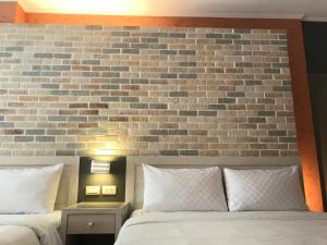 Postel nebo postele na pokoji v ubytování 墾丁合歡8宿-Ho Huan B & B