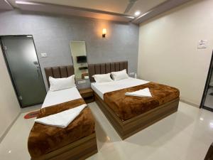 Postel nebo postele na pokoji v ubytování HOTEL DIVINE